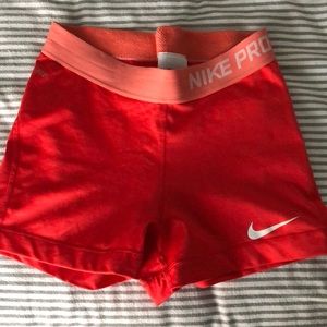 Pink Nike Pro compression shorts